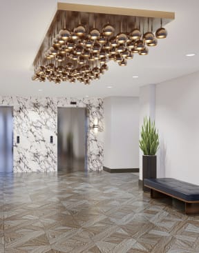 a rendering of a lobby with purple chairs and a gold chandelier