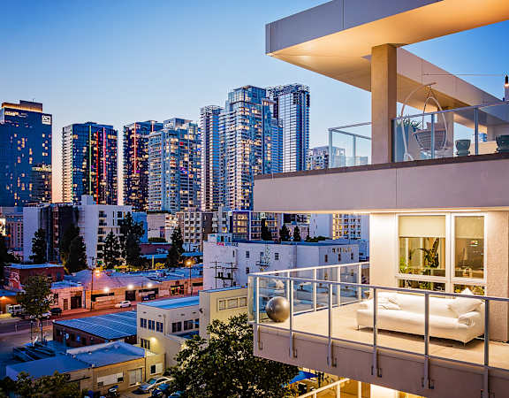 emerald apartment building with balcony views of downtown los angeles