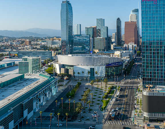 an aerial view of the los angeles convention and exhibition center with the city in the background
