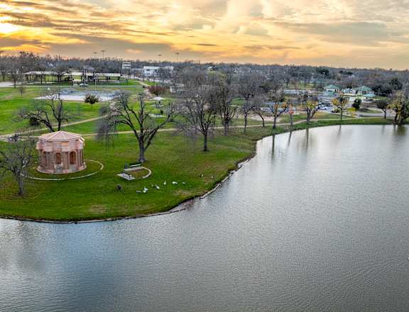 an aerial view of a park next to a body of water at Mihir Taylor, Texas