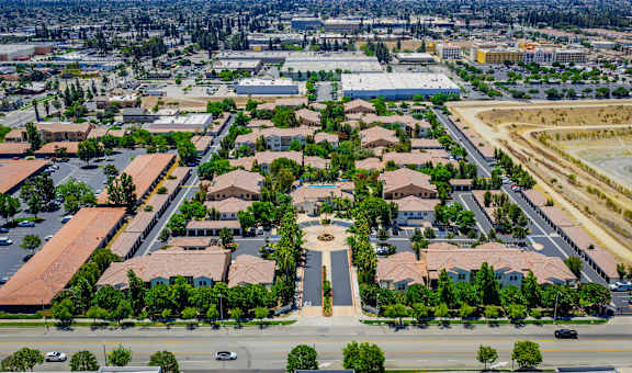 A bird's eye view of a residential area with a central square.
