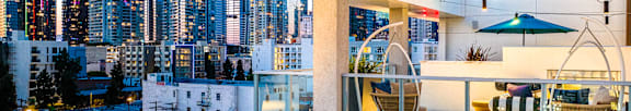 exterior of emerald apartments balconies and view of downtown los angeles