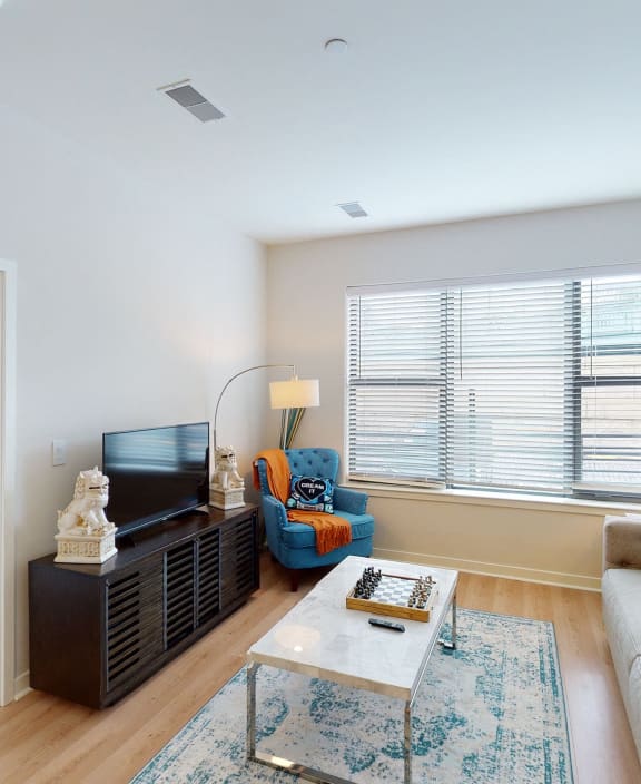 a living room with a couch and a coffee table and a bedroom with a bed at The View at Old City, Philadelphia