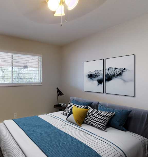A bedroom with a large bed and a couch.