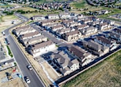 Thumbnail 8 of 8 - an aerial view of a neighborhood with houses and a road