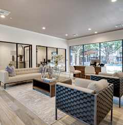 A modern living room with a large sofa and a coffee table.