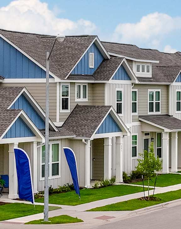 a row of town homes with blue doors