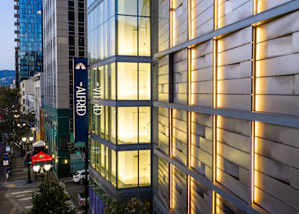 A modern building with a sign that reads "AliFORD" is shown.