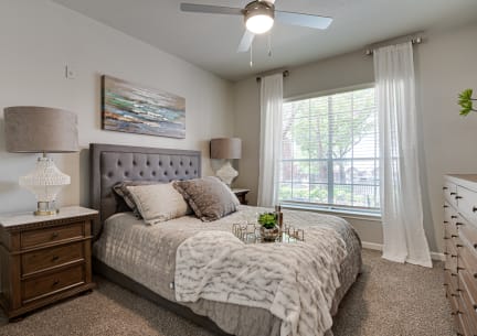 Bedroom with a large window and a ceiling fan at Mason, McKinney,