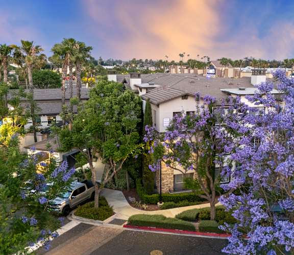A residential area with houses and trees.