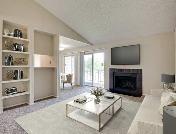 A living room with a fireplace and a television.