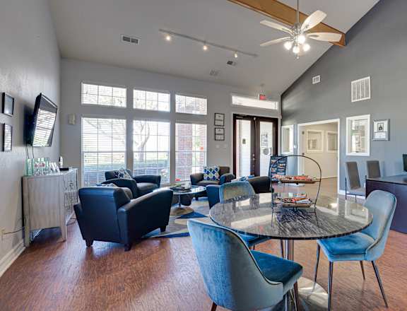 A room with a table and chairs in it.