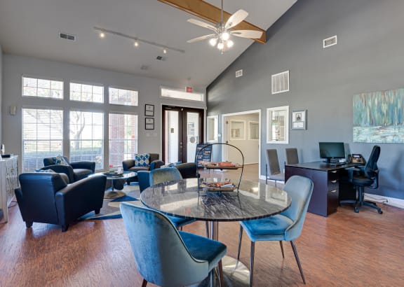 a living room with a round table and chairs and a desk with a computer at Paces Crossing, Denton, 76210