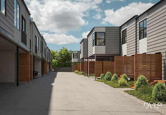 A row of modern houses with a driveway in between.
