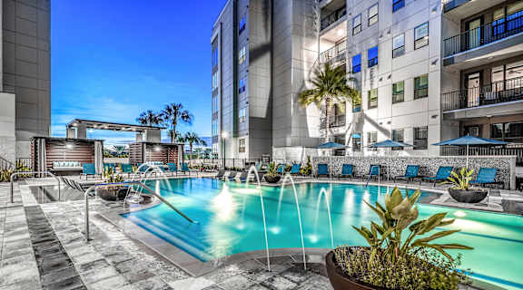 a swimming pool with a building in the background