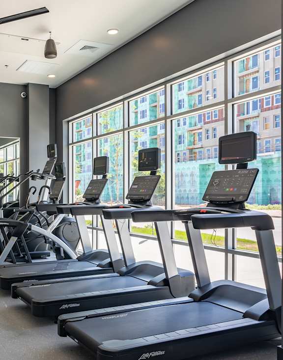 A gym with treadmills, weights, and exercise equipment. at Railside at Wadsworth Station, Lakewood, CO