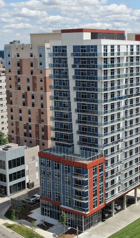 an aerial view of an apartment building in the city