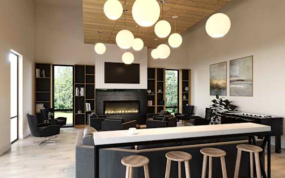 A modern living room with a fireplace and a bar area.at Alante Homes at Spring Run, Caldwell, ID