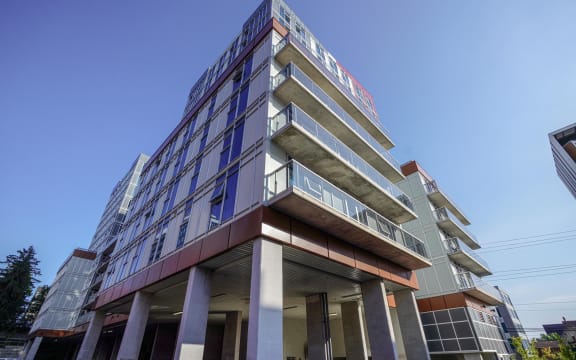 a tall building with a blue sky in the background