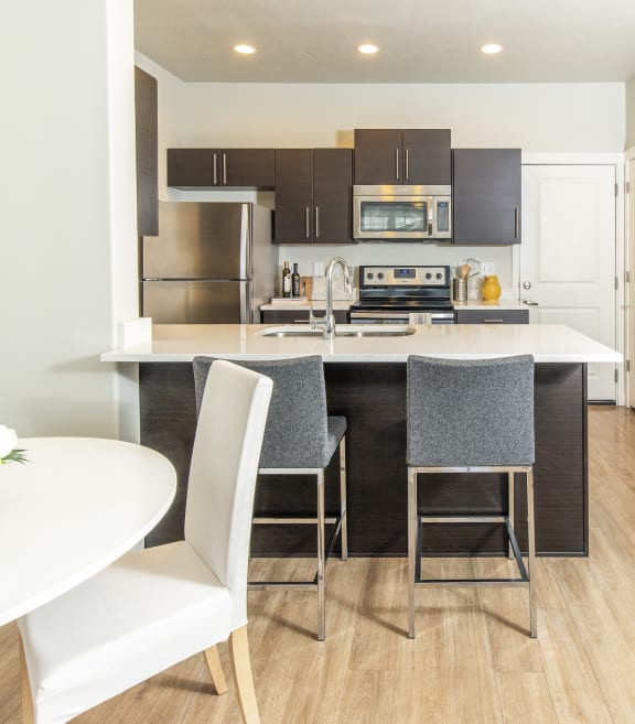 a kitchen and dining area in a 555 waverly unit