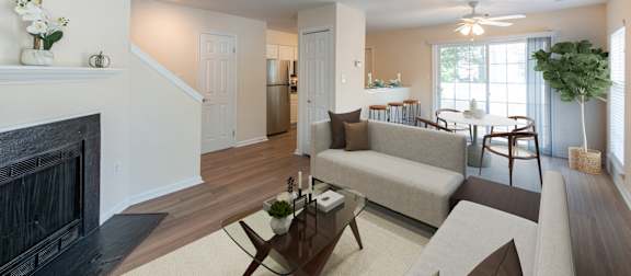Living room with white couch at Saratoga Square, Virginia, 22153