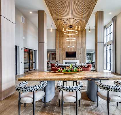 a large kitchen with a wooden table and chairs