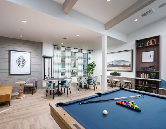 Aurora Apartments clubroom featuring billiard table