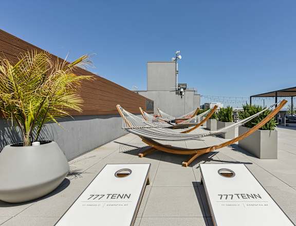 a group of hammocks on the roof of a building