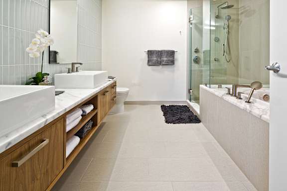 a bathroom with two sinks and a shower at Stadium Place, Seattle, WA, 98104