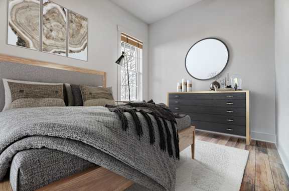 a bedroom with a bed and a dresser