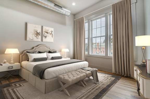 a bedroom with a bed and a window