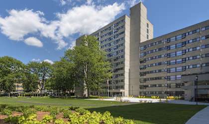 an office building with a lawn and trees in front of it at Baystate Place, Springfield, 01104