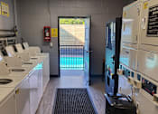 Thumbnail 8 of 14 - a kitchen with a pool and a door in the back