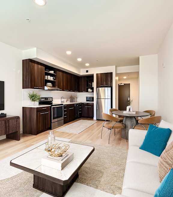 A modern living room with a white couch and a coffee table.