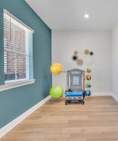 small room with a rack with exercise balls on it at spire luxury apartments in charlotte nc