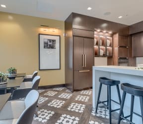 a kitchen with a large island with a marble countertop