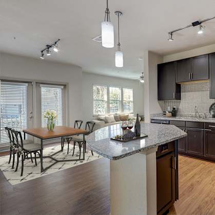 a kitchen with stainless steel appliances and a granite counter top