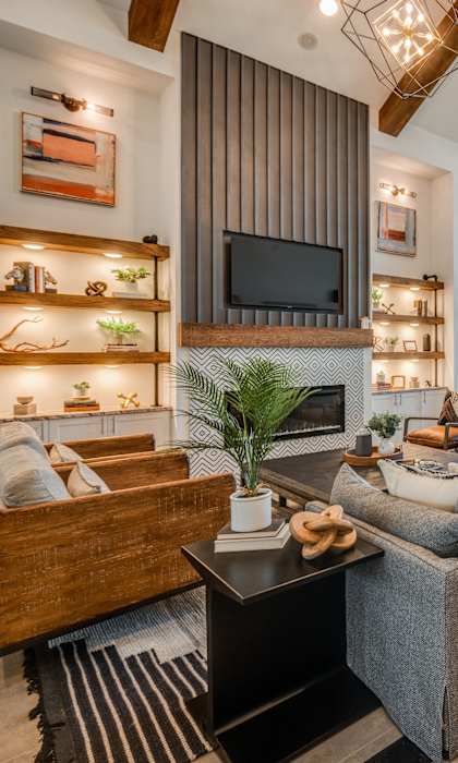 A modern living room with a wooden coffee table and a grey sofa.
