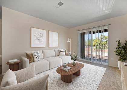 a living room with a white couch and a coffee table