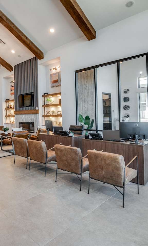 A modern living room with a grey sofa and a wooden coffee table.