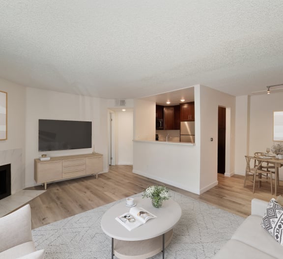 a living room with a fireplace and hardwood floors at Croft Plaza Apartments, West Hollywood, 90069