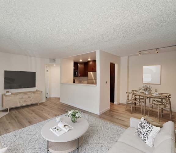 a living room with a fireplace and hardwood floors at Croft Plaza Apartments, West Hollywood, 90069