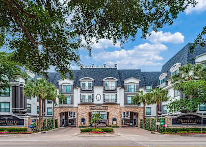 The Montecito building is a large, luxurious residence with a grand entrance and landscaped grounds. at Montecito Apartments, Texas, 77056