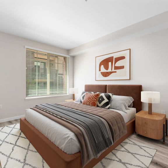 a bedroom with a large bed in a 555 waverly unit