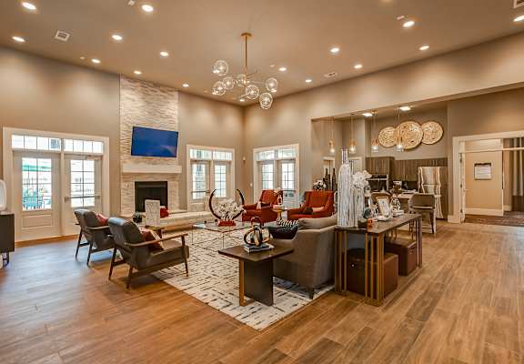 a large living room with a fireplace and hardwood floors