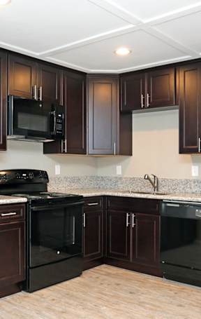 Kitchen with black appliances and granite counter tops
