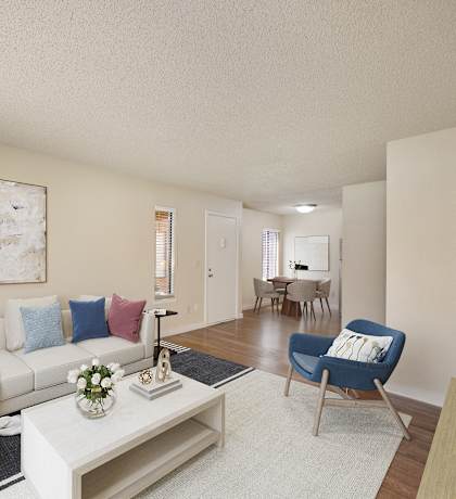 a living room with a white couch and a coffee table