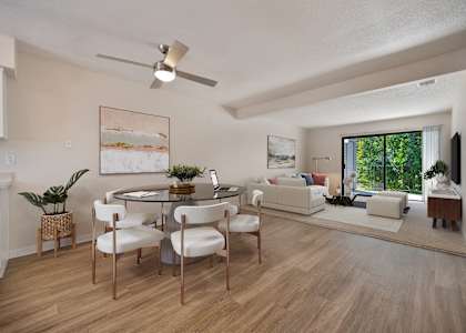 an open living room and dining room with a table and chairs at Silverstone Apartments, Davis