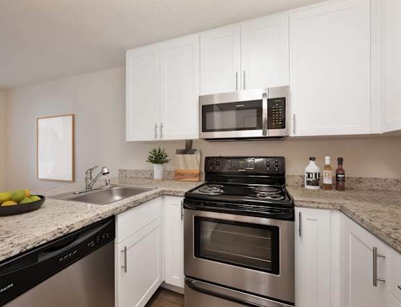 our apartments offer a kitchen with stainless steel appliances and granite counter tops at Rush River Apartments, California