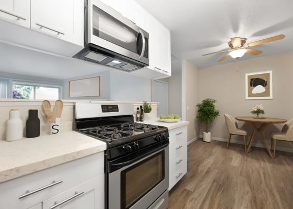 Bedroom with Window and Blue Curtains, Carpet, and  Lamps at Cobblestone Creek Apartments, Roseville, 95661,